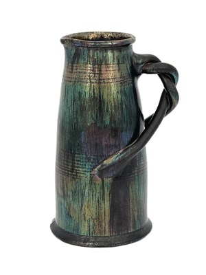 Lot 619 - An art pottery iridescent jug, conical barrel...