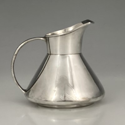 Lot 207 - An Arts and Crafts silver jug, Henry Hobson...