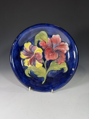 Lot 86 - Walter Moorcroft, a Hibiscus plate, circa 1960,...