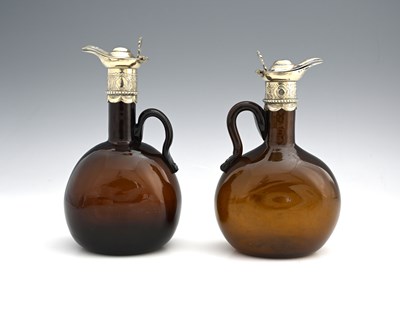 Lot 5 - Two nineteenth-century brown glass bottle...