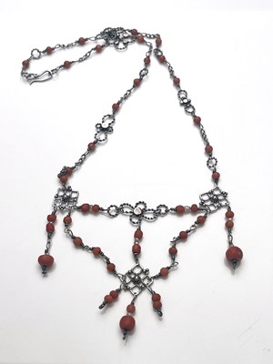 Lot 37 - An Arts and Crafts silver and coral necklace,...