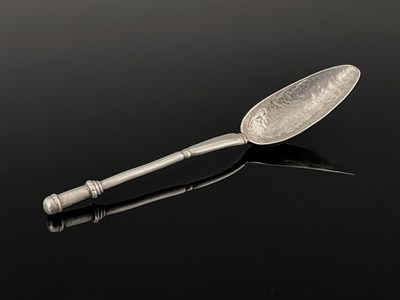 Lot 202 - An Arts and Crafts silver grapefruit spoon,...