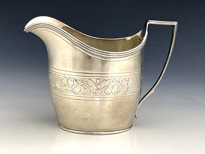Lot 70 - A George III silver jug, London 1803, helmet...