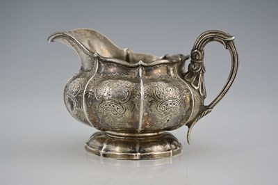 Lot 279 - A William IV silver milk jug, of panelled...