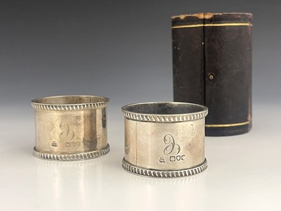 Lot 75 - A boxed pair of Victorian silver napkin rings,...