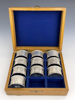 Lot 81 - A boxed set of ten Victorian silver napkin...
