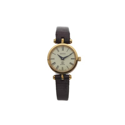 Lot 288 - Gucci, a vintage gold plated and enamel wrist watch