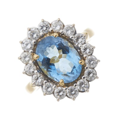 Lot 32 - An 18ct gold aquamarine and diamond cluster ring