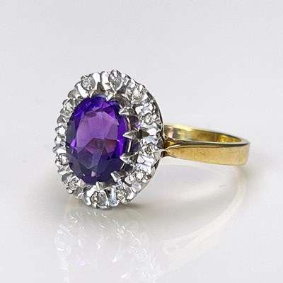 Lot 19 - An 18 carat gold and amethyst cluster ring,...