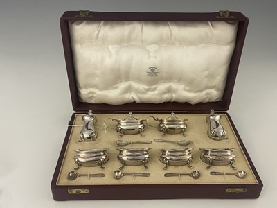 Lot 83 - A George VI silver cased condiment set,...