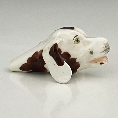 Lot 736 - A Staffordshire porcelain novelty dog whistle,...