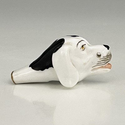 Lot 739 - A Staffordshire porcelain novelty dog whistle,...