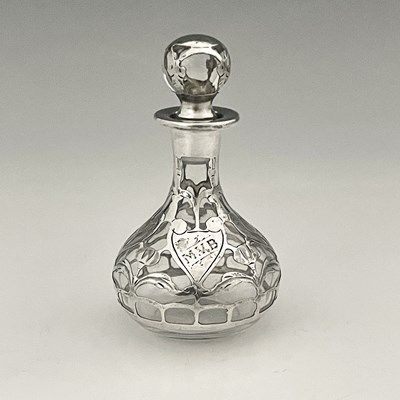 Lot 194 - An American Art Nouveau silver overlay scent...