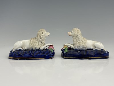 Lot 725 - A pair of Staffordshire porcelain dog figure...