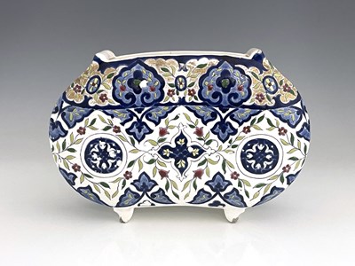 Lot 590 - A French Aesthetic Movement faience enamelled...