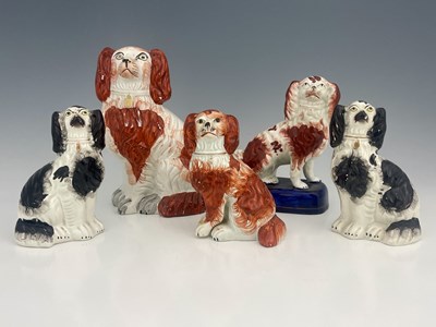 Lot 731 - A collection of Staffordshire dog figures,...