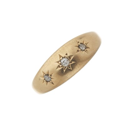 Lot 60 - An early 20th century 18ct gold diamond three-stone band ring