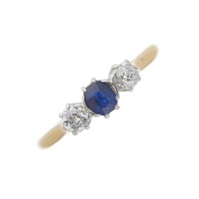 Lot 59 - An early 20th century 18ct gold sapphire and diamond three-stone ring