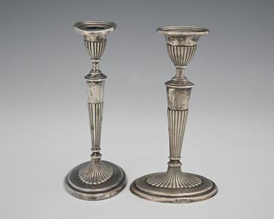 Lot 131 - A pair of George V silver candlesticks,...