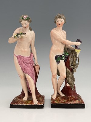 Lot 738 - A pair of Staffordshire pottery figures of...