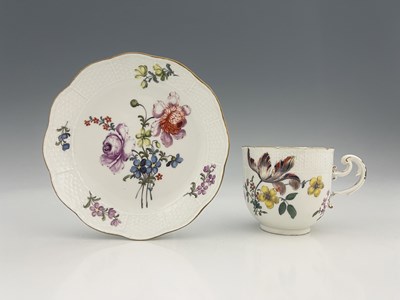 Lot 592 - A Meissen floral painted cup and saucer,...