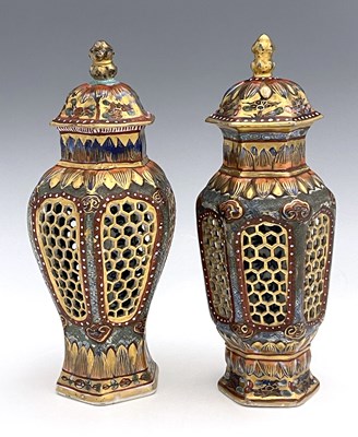 Lot 431 - A matched pair of Chinese reticulated vases...