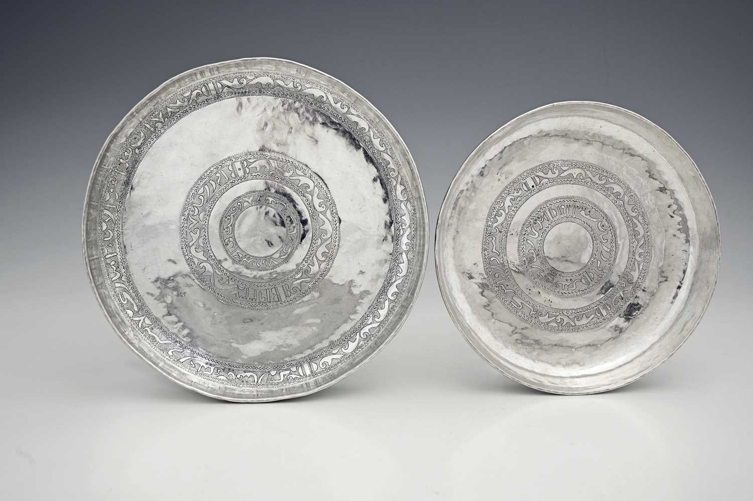 Lot 223 - Two Eastern silver-coloured metal graduated