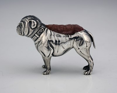 Lot 167 - An Edwardian novelty silver pin cushion,...