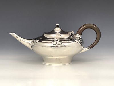 Lot 206 - A E Jones, an Arts and Crafts silver teapot,...
