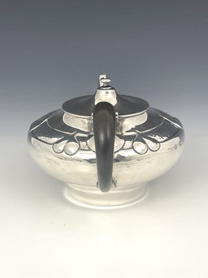 Lot 206 - A E Jones, an Arts and Crafts silver teapot,...