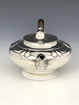 Lot 206 - A E Jones, an Arts and Crafts silver teapot,...