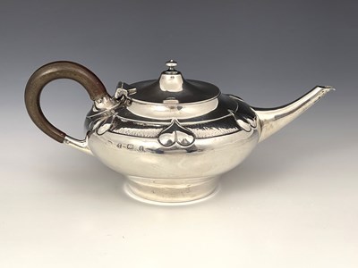 Lot 206 - A E Jones, an Arts and Crafts silver teapot,...