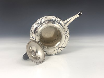 Lot 206 - A E Jones, an Arts and Crafts silver teapot,...