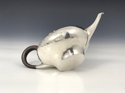 Lot 206 - A E Jones, an Arts and Crafts silver teapot,...
