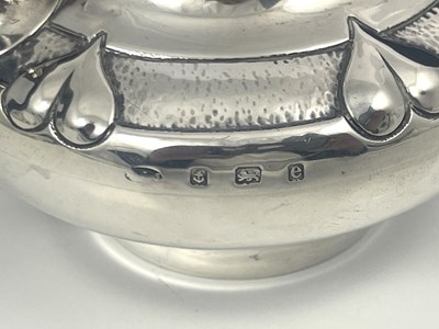 Lot 206 - A E Jones, an Arts and Crafts silver teapot,...