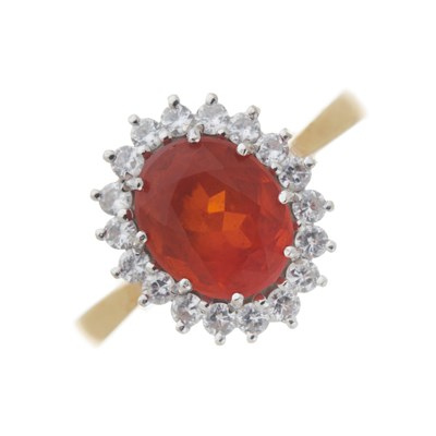 Lot 136 - An 18ct gold fire opal and diamond cluster ring