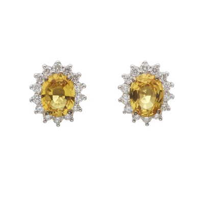 Lot 30 - A pair of 18ct gold yellow sapphire and diamond cluster stud earrings