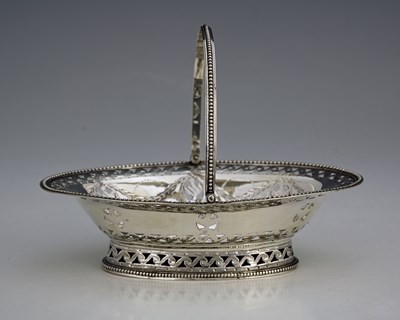 Lot 152 - A George III silver Neoclassical swing-handle...