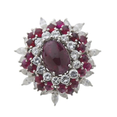 Lot 104 - An 18ct ruby and diamond cluster dress ring