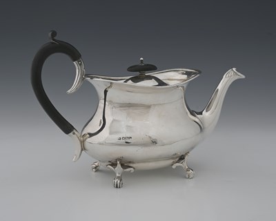 Lot 339 - A George V silver teapot, of ogee form, with...