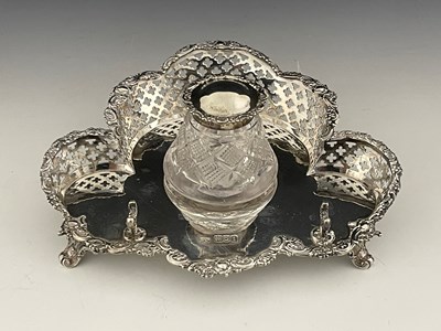 Lot 284 - An Edwardian silver inkstand, of trefoil form,...