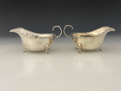 Lot 345 - A pair of Edward VIII silver sauceboats, each...