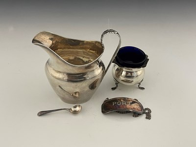 Lot 278 - An Edwardian silver cream jug, of helmet form...