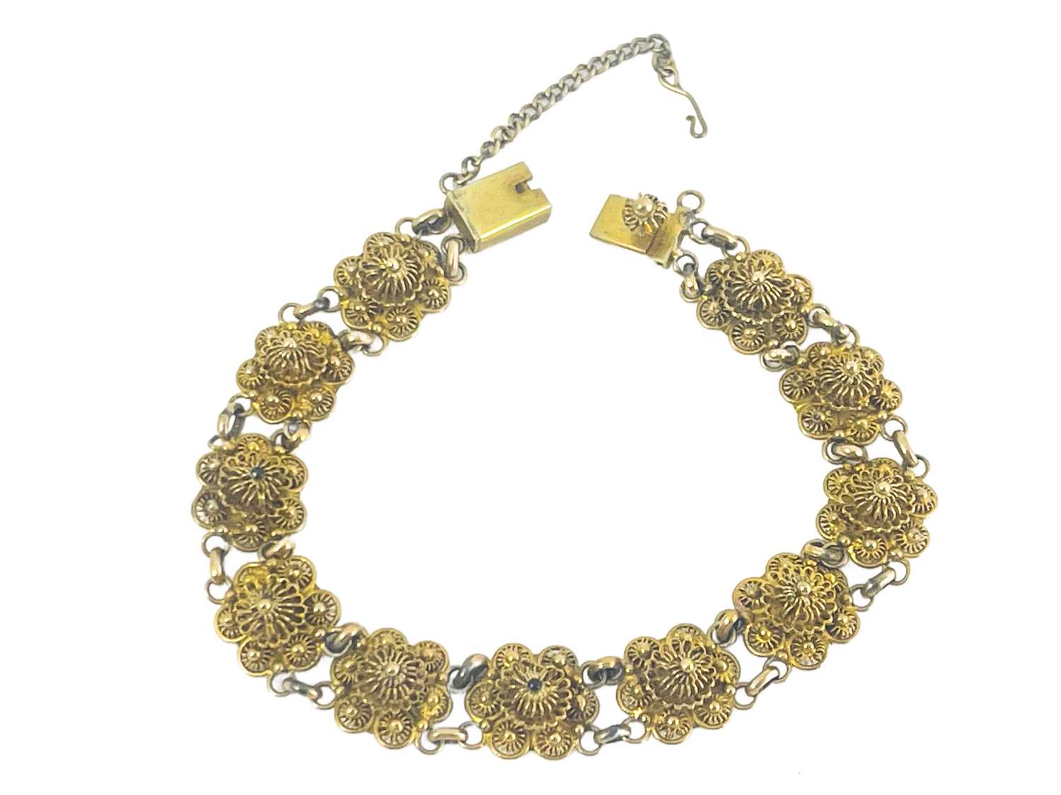 Lot 263 - A 14 carat gold filigree bracelet, each link...