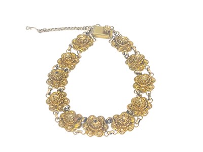 Lot 263 - A 14 carat gold filigree bracelet, each link...