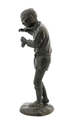 Lot 323 - A Japanese Meiji bronze figure, modelled as a...