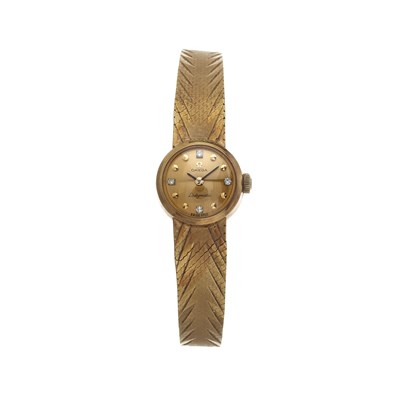 Lot 203 - Omega, an 18ct gold diamond Ladymatic bracelet watch