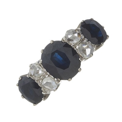 Lot 132 - A mid 20th century 18ct gold sapphire and diamond three-stone ring