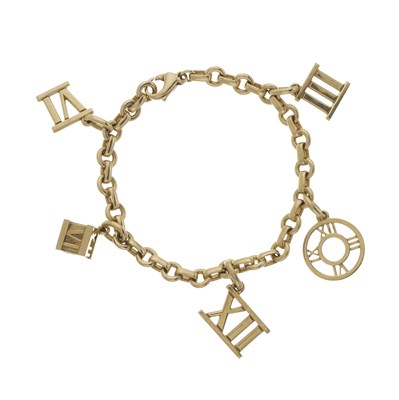 Lot 108 - Tiffany & Co., an 18ct gold Atlas charm bracelet