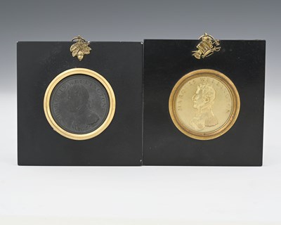 Lot 129 - Two cast metal medallion portrait plaques for...